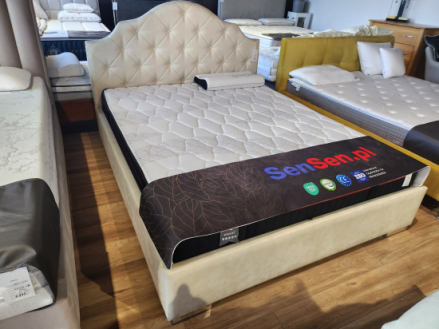 Łóżko tapicerowane w kolorze beżowym160x200 cm z pojemnikiem na pościel